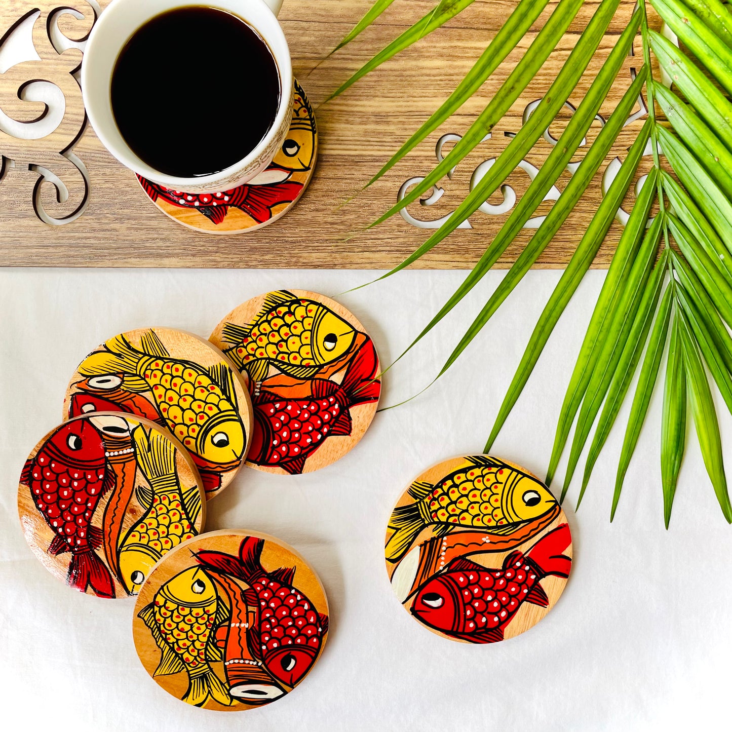 Alokya - round coasters: fish painted on the surface.