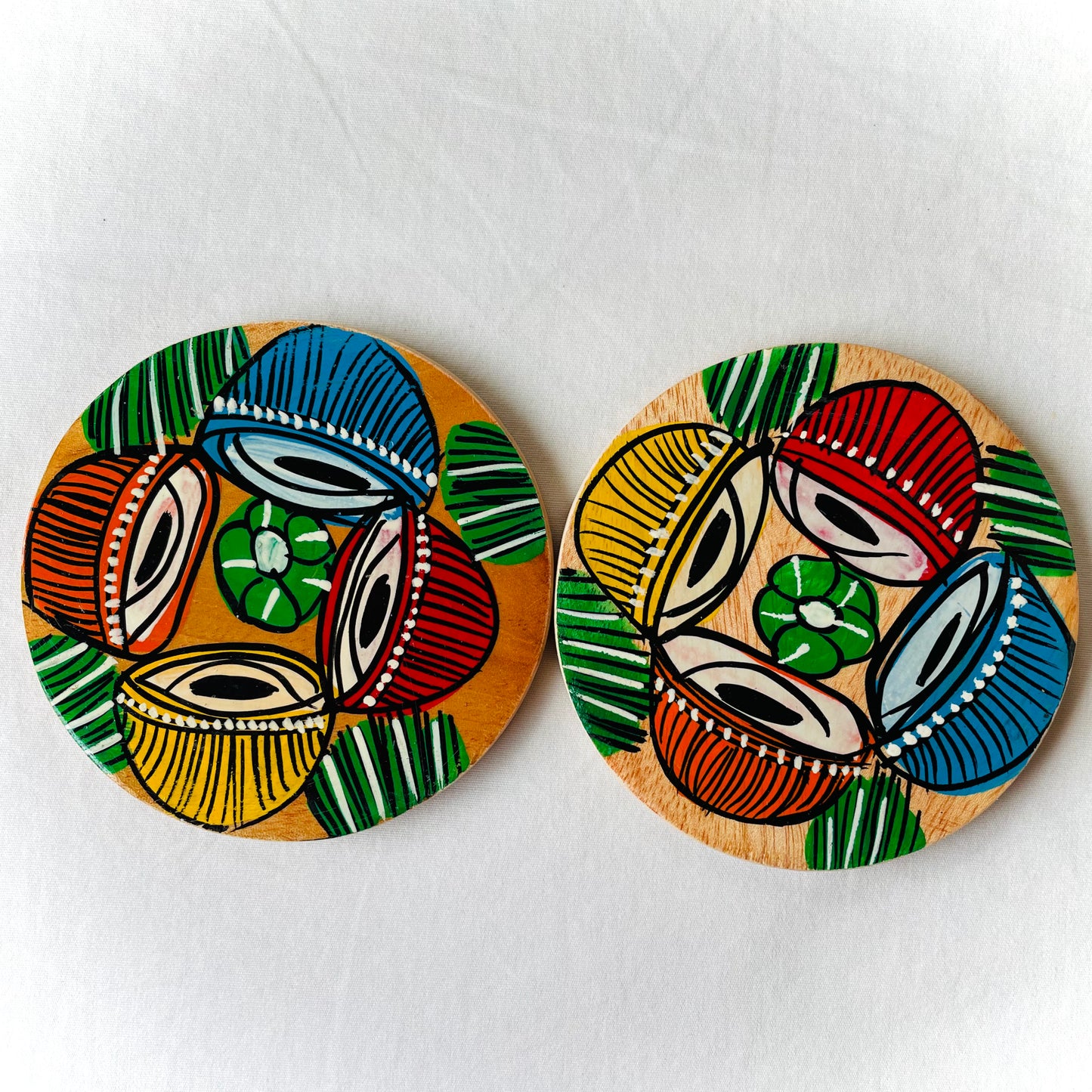 Alokya - Round coasters: Tabla painted on the surface. Set of two.