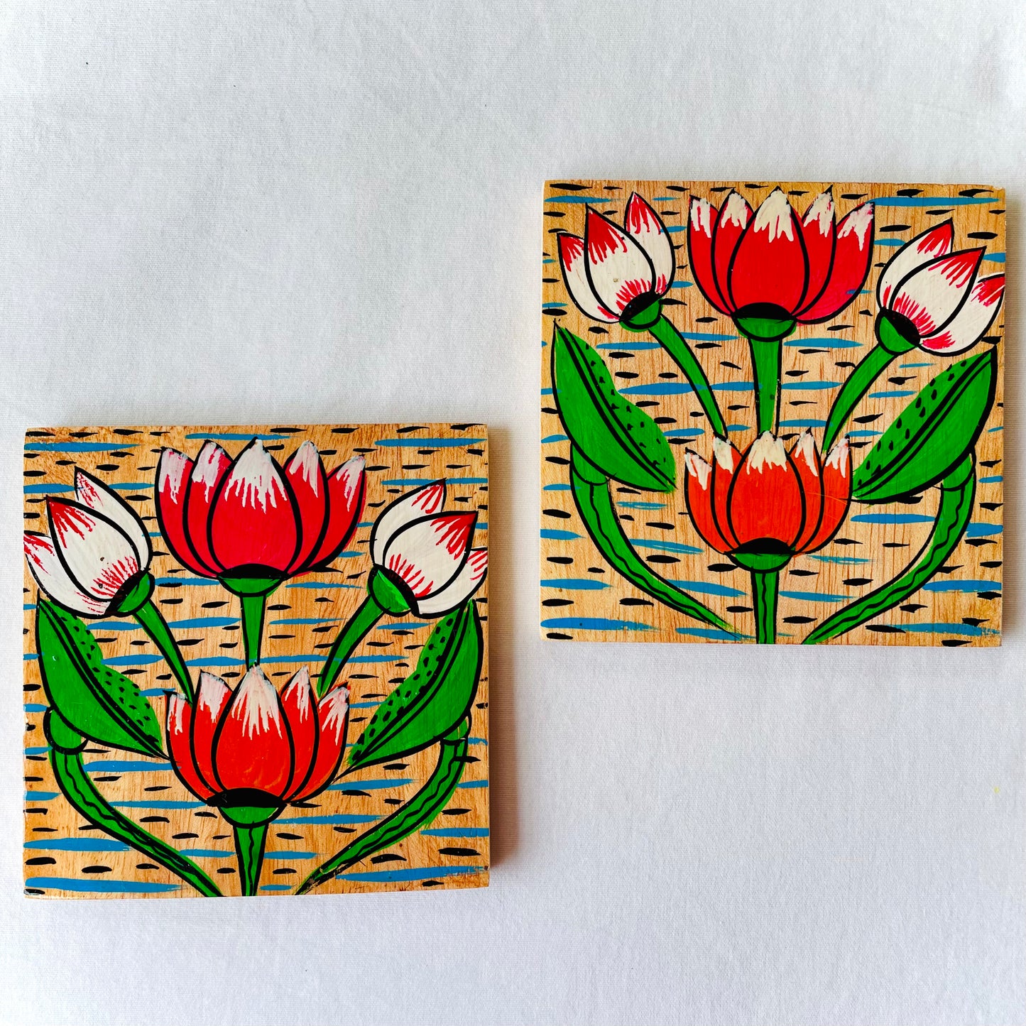 Alokya - 100% natural, Pattachitra painted terracotta coasters - 100% natural, Pattachitra painted terracotta coasters - Round coasters: Lotus painted on the surface.