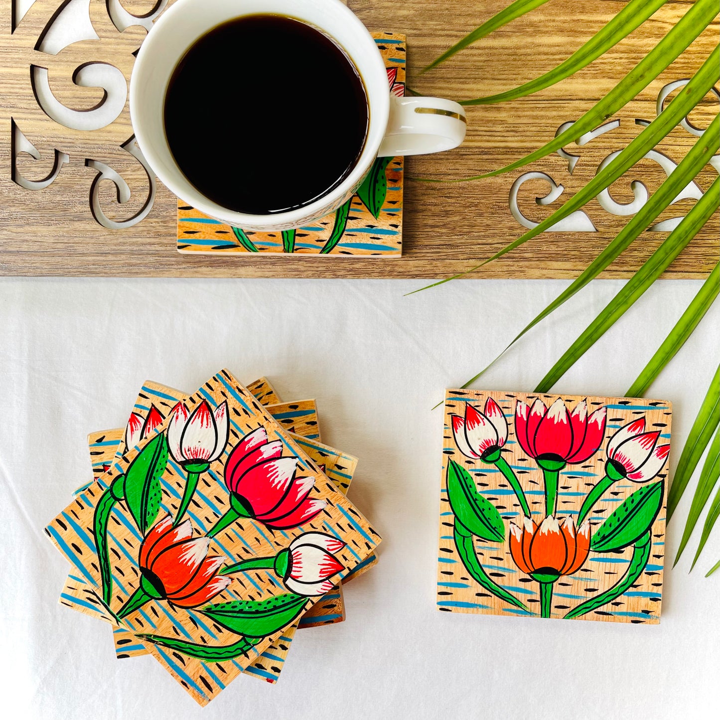 Alokya - 100% natural, Pattachitra painted terracotta coasters - Square coasters: Lotus painted on the surface.