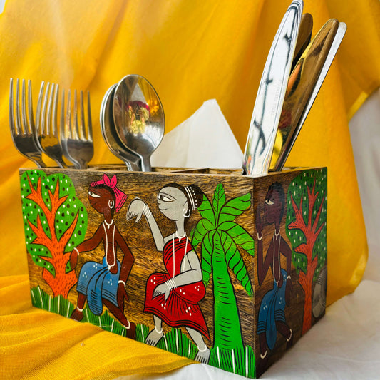 Three spoons, three forks and three knives organised in a pure mango wood cutlery holder showcasing pattachitra painting of a tribal celebration surrounded by trees
