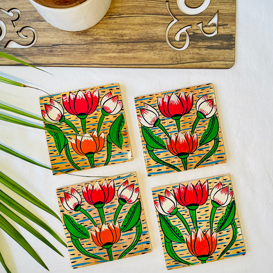 Four pure mango wood sqaure wooden coasters, with a painting of four lotus with leaves and water in each wood coaster