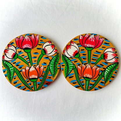 Alokya - 100% natural, Pattachitra painted terracotta coasters Round coasters: Lotus painted on the surface. Set of two.