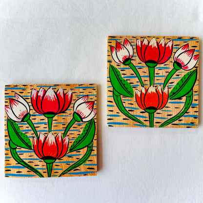 Two square wood coasters displayed against a white background, featuring four lotus with leaves and water in each wood coaster