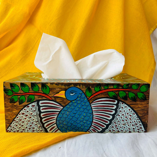 White tissue paper in a handcrafted pure mango wood 9” x 5” x 3” wood tissue box, hand painted with peacock motif by the generational pattachitra artists