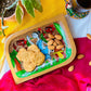 Biscuits and almonds are served in a handcrafted mango wood rectangular wooden tray or a trinket tray, painted with tribal motif by generational Pattachitra artists