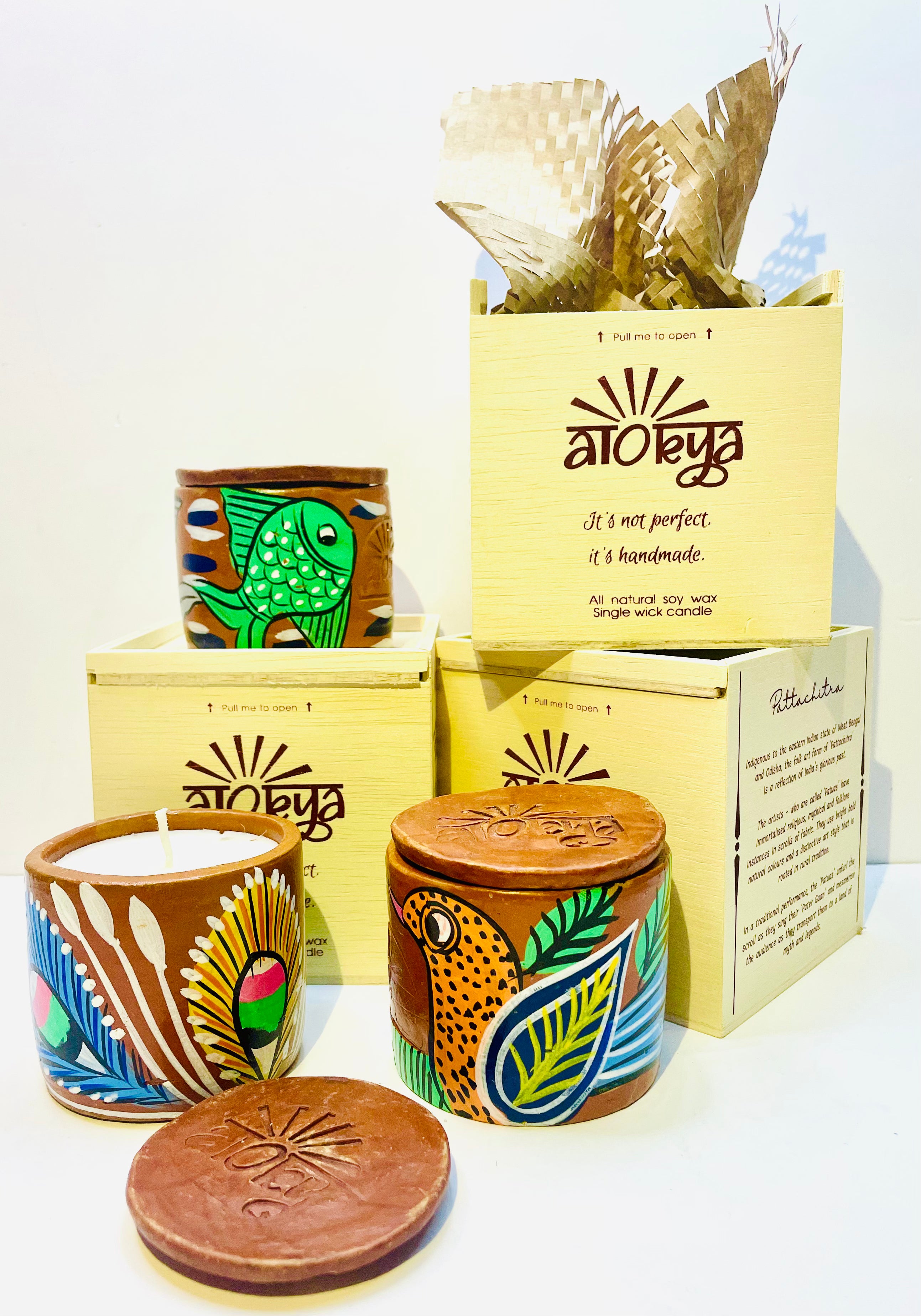 Alokya - 100% natural, soy wax scented candles handpoured in Pattachitra painted terracotta jars.