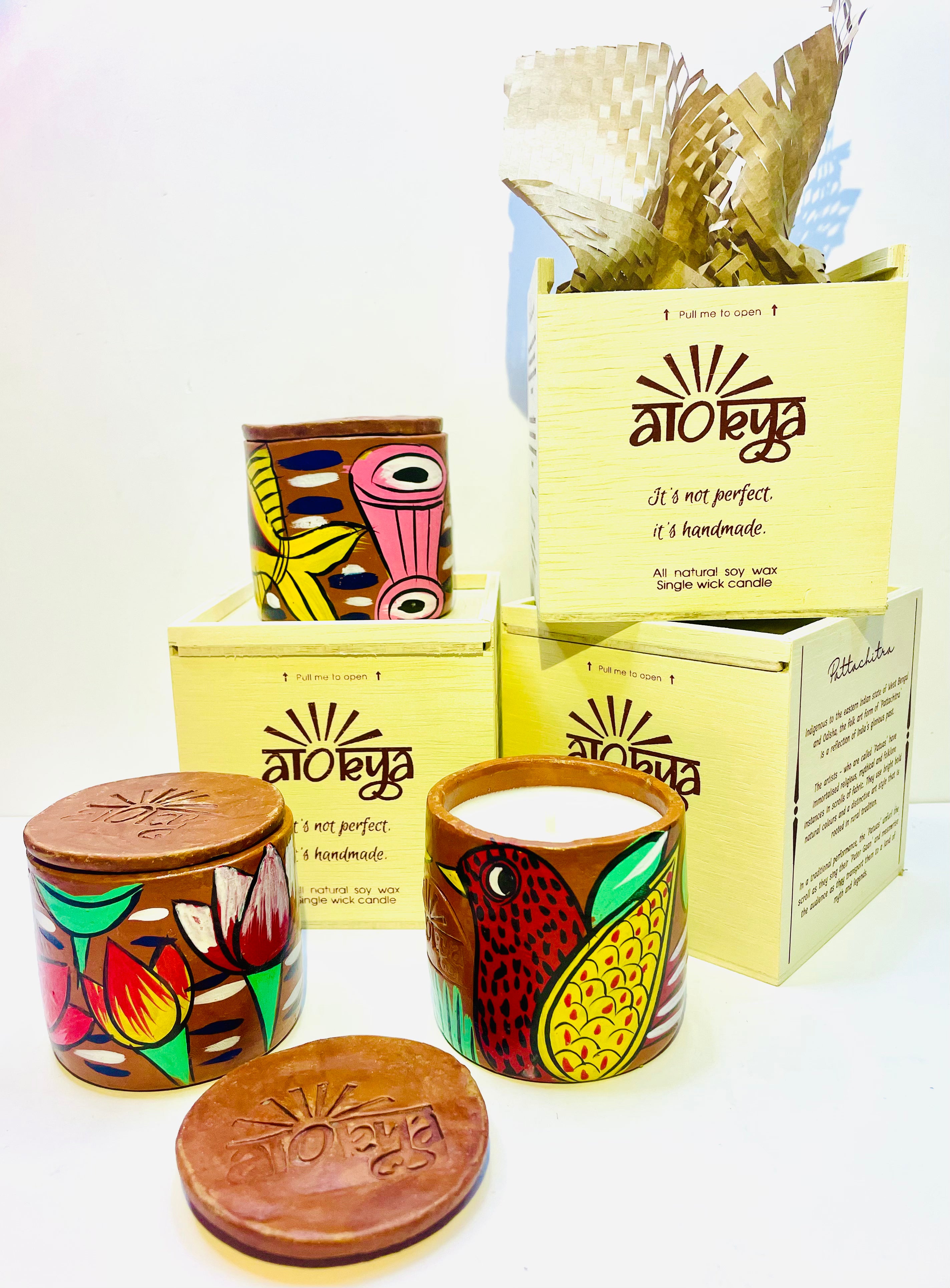 Alokya - 100% natural, soy wax scented candles handpoured in Pattachitra painted terracotta jars.