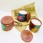 Alokya - 100% natural, soy wax scented candles handpoured in Pattachitra painted terracotta jars.