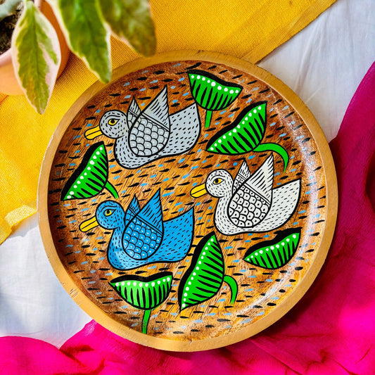 Round wooden tray or trinket tray made from locally sourced mango wood and hand-painted with three bird motifs by the generational Pattachitra artists of Pingla
